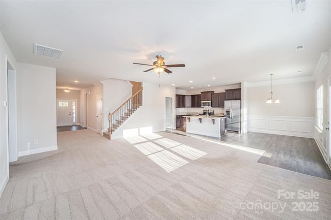 Wide Angle View of the front door and foyer area. Includes view of stairs to 4th bedroom and Loft/Bathroom areas. Unstaged. | Image 4