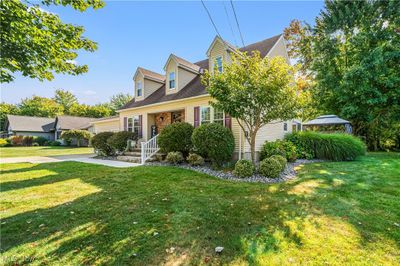 Cape cod-style house with a gazebo and a front yard | Image 2