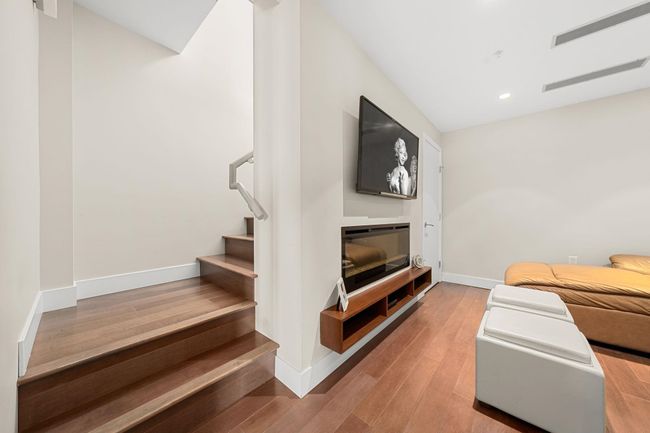 Stairway featuring wood finished floors and recessed lighting | Image 24