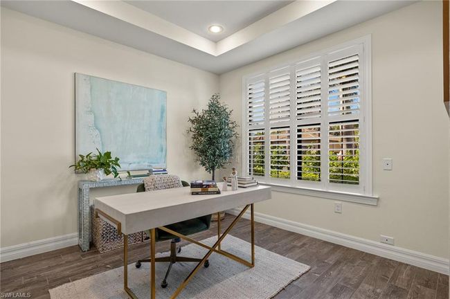 Office with a raised ceiling and dark hardwood / wood-style flooring | Image 26