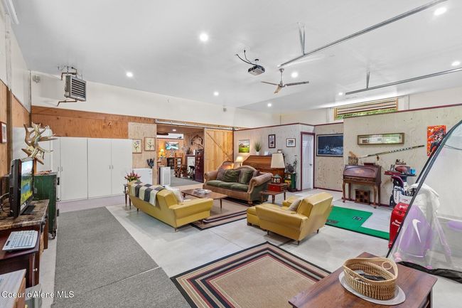 From back area towards front hallway with barn door open | Image 17