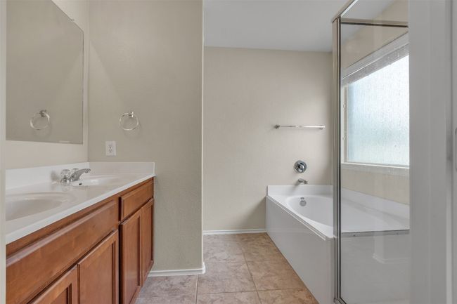 Fabulous double vanity, walk in shower and soaker tub along with a separate toilet | Image 6