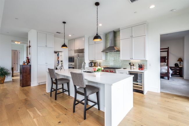 View of kitchen with glimpse of primary bedroom. | Image 14