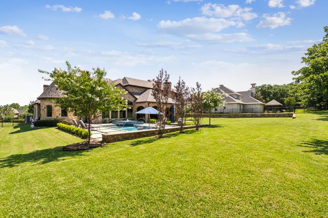 The Pool Is Nestled Within a Lush, Green Lawn in a Spacious Yard | Image 33