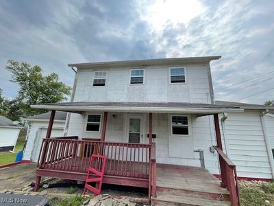 View of front of home with covered porch | Image 1