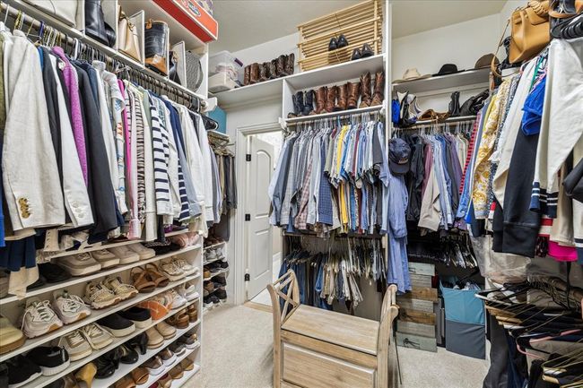 One must be very brave to show their closet! Note the door leading from the primary closet to the laundry room. | Image 19