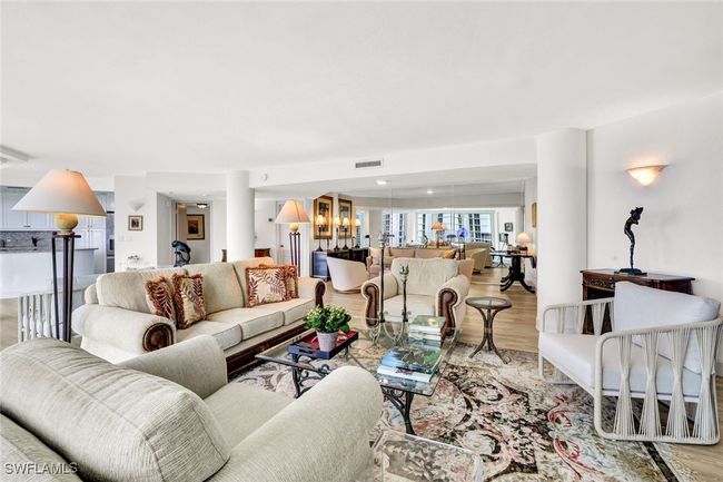 Living area with light wood-style floors and visible vents | Image 6