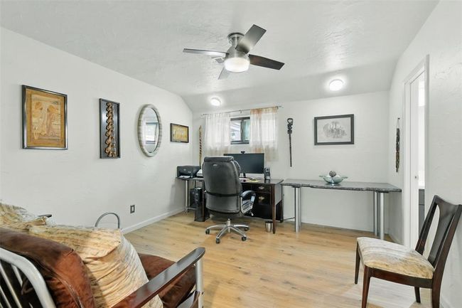 The fourth bedroom also features vinyl plank floors (2016) and an updated ceiling fan. The Jack N Jill full bathroom is shared between the fourth and fifth bedroom. | Image 27