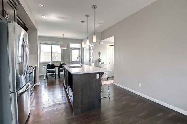 558 Panatella Walk Nw, Home with 2 bedrooms, 2 bathrooms and 3 parking in Calgary AB | Image 4