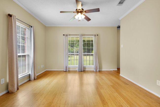 Second Living or Office space featuring a ceiling fan, light wood-type flooring, and crown molding | Image 10