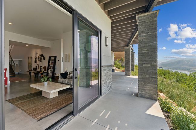 View of patio / terrace featuring a water and mountain view | Image 65
