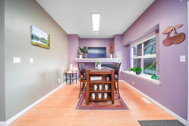 Dining space featuring baseboards and light wood-style floors | Image 13