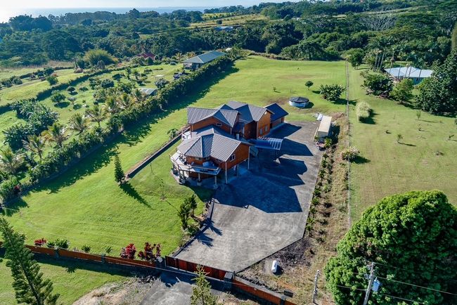 Enter your Estate through the electric gate, lots of space for parking when you are entertaining. Outdoor cover lanai for BBQ also an outdoor shower for when you get home from the beach or want to wash the dogs. | Image 23