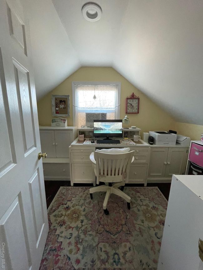 Home office featuring vaulted ceiling | Image 16