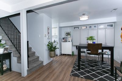 Dining area featuring dark hardwood / wood-style flooring | Image 1