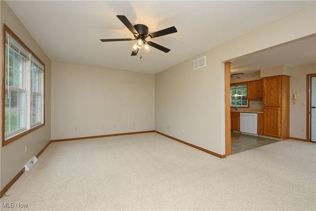 Spare room with light carpet and a ceiling fan | Image 7