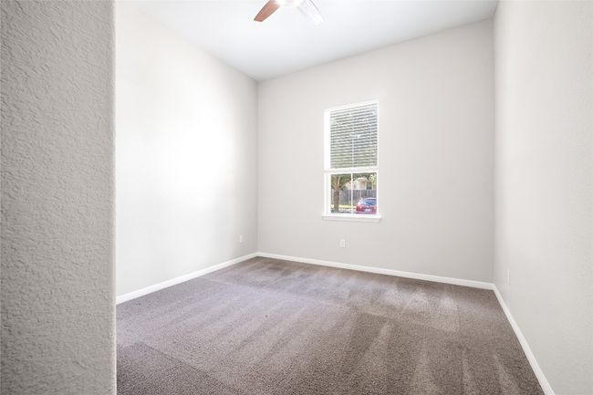 Empty room featuring ceiling fan and carpet flooring | Image 30