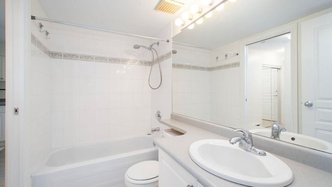 Bathroom with vanity and tub / shower combination | Image 9