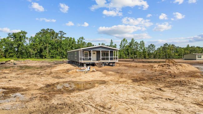 Back of house featuring a sunroom | Image 35