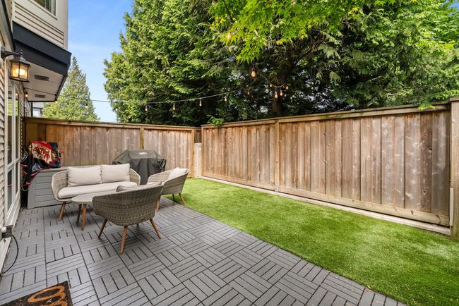 View of patio featuring area for grilling | Image 34