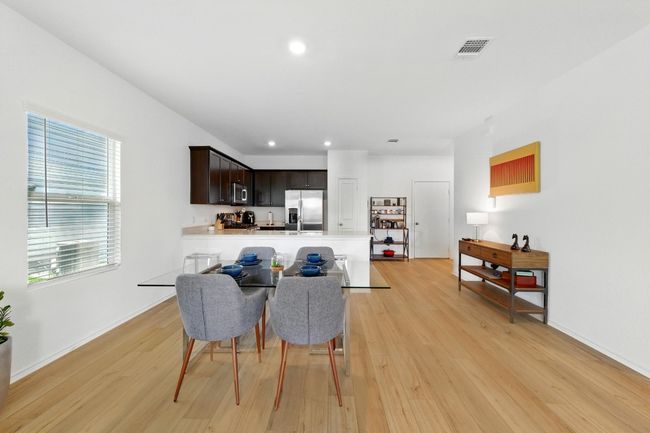 Dining area with light wood-style flooring, recessed lighting, and baseboards | Image 9