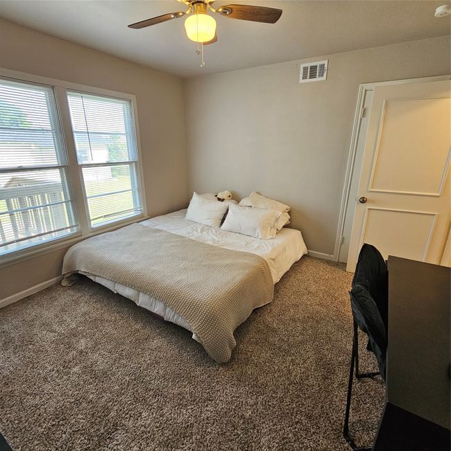 Carpeted bedroom with baseboards and a ceiling fan | Image 18