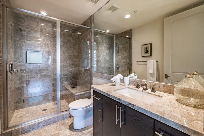 Luxurious full secondary bathroom with elegant finishes and a spacious shower. | Image 19