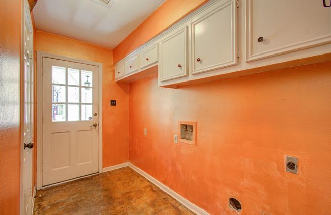 MUD room of the back with storage cabinets. | Image 30