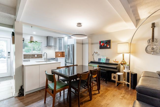Dining area with light wood finished floors | Image 10