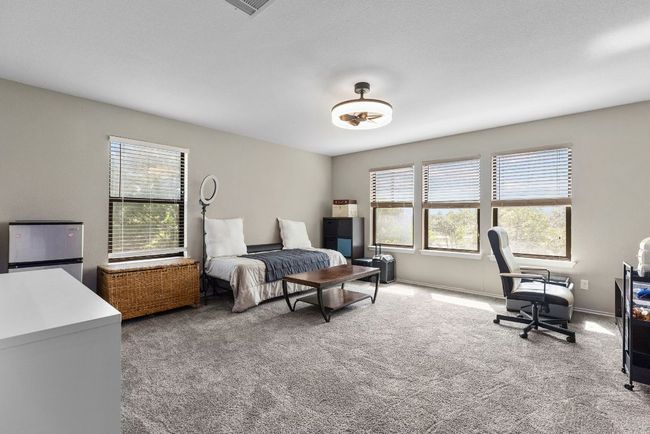 Office area featuring plenty of natural light and carpet floors | Image 17