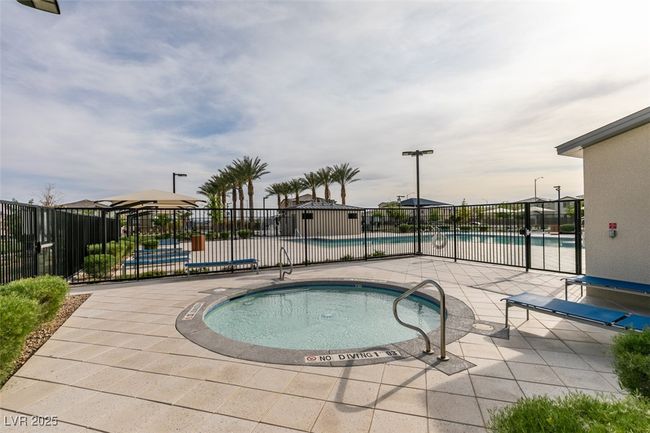 Community pool featuring a patio area and fence | Image 8
