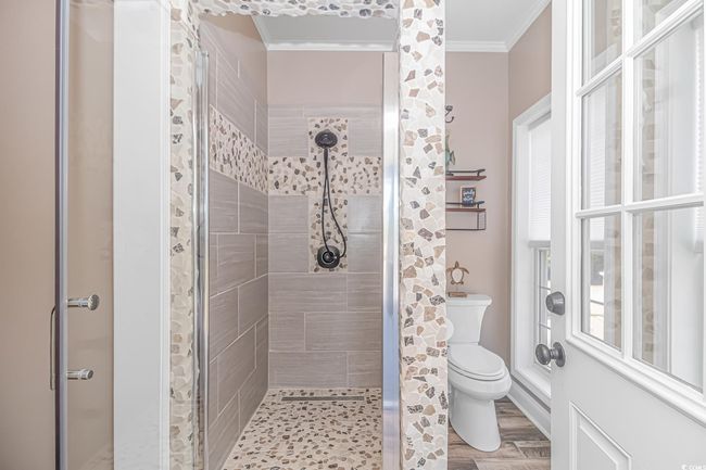 Bathroom featuring crown molding and a stall shower | Image 18