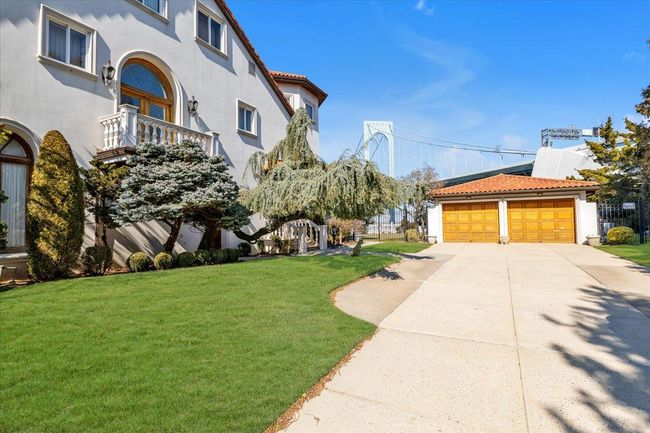Long driveway leading to a 6 car garage | Image 28