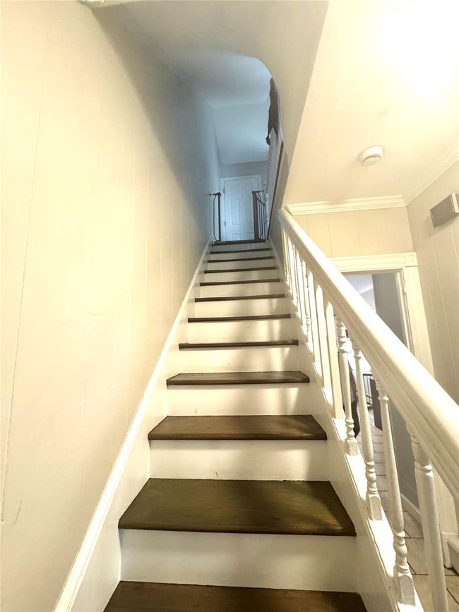 Staircase featuring crown molding | Image 6