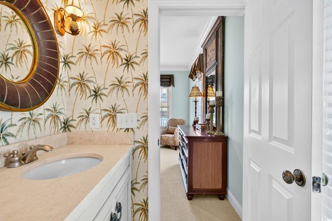 Ensuite bathroom featuring vanity and ornamental molding | Image 33