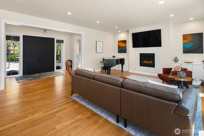 Looking back toward the front entry, with the powder room conveniently tucked away to the right of the doors. | Image 6
