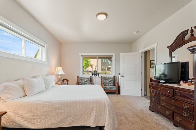 Bedroom featuring light colored carpet | Image 17