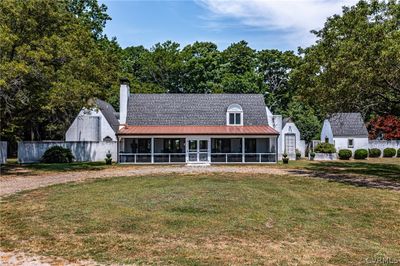 View of front of property featuring a front lawn and a sunroom | Image 2