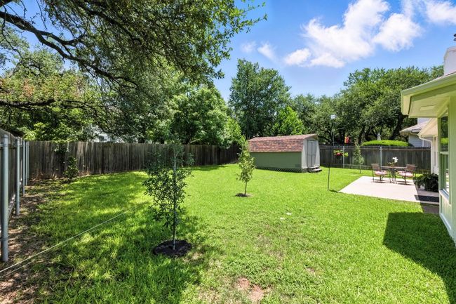 Backyard is expansive with a shed | Image 22