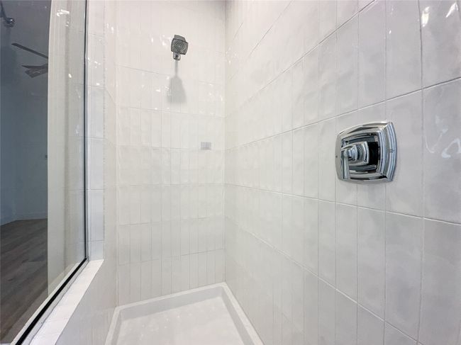 Full bathroom with a tile shower | Image 22