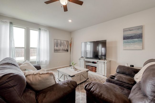 Living area featuring baseboards, recessed lighting, and a ceiling fan | Image 9