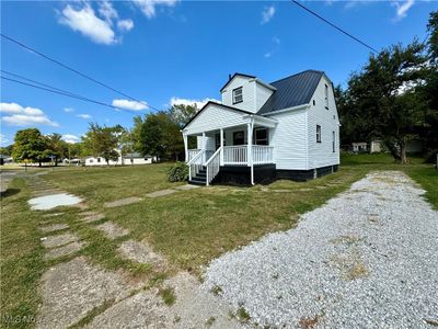 View of front of house with a front lawn and covered porch | Image 2