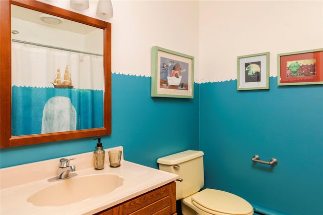 Bathroom featuring toilet and vanity | Image 21