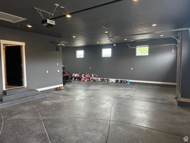 Garage with recessed lighting, a garage door opener, and baseboards | Image 28