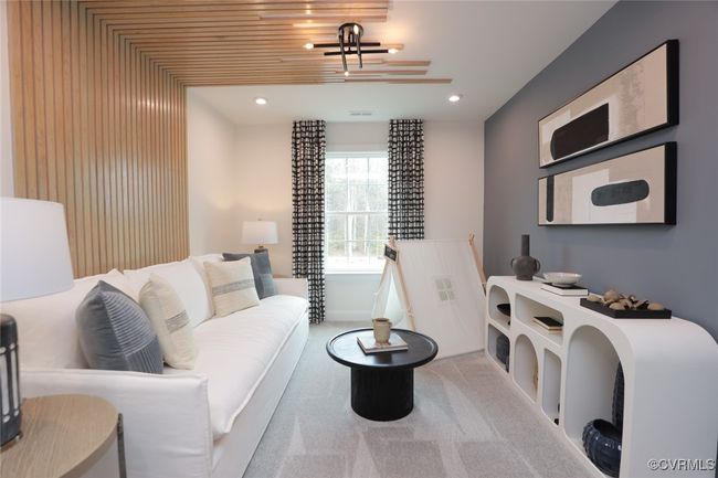 A spacious loft with carpet finishes the second floor. | Image 6