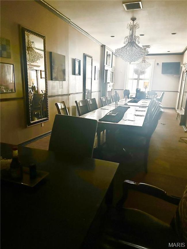 Dining room featuring visible vents, crown molding, and a notable chandelier | Image 16