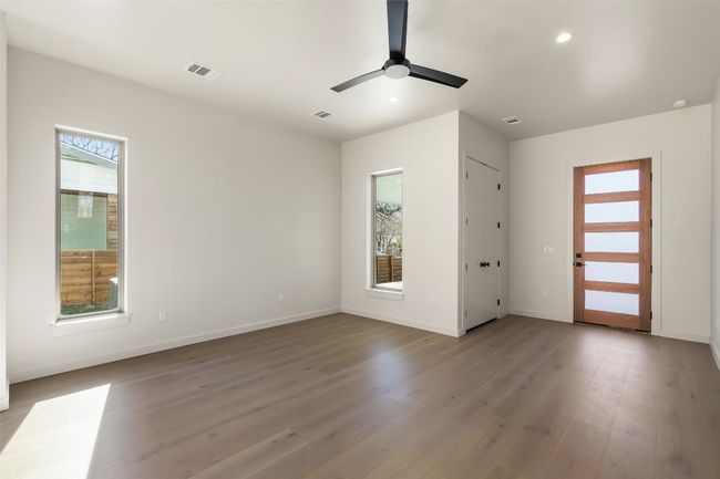 Empty room featuring light wood-type flooring, visible vents, and baseboards | Image 6