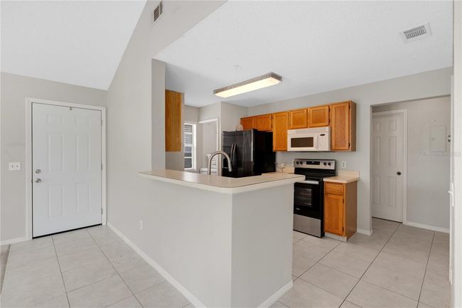 The kitchen from a dining room view | Image 9