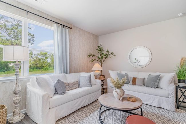 Living room with plenty of natural light and wood finished floors | Image 10