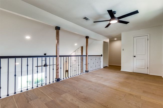 Spare room with ceiling fan, wood finished floors, and recessed lighting | Image 13